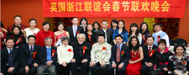 Figure 6: Consul General Tang Li of the Chinese Embassy in the UK (驻英使馆总领事唐立) (front row middle, left of Lord Wei), Counsellor for Overseas Chinese Affairs Li Hui (李辉) (back row, sixth from right) Dr Shan Sheng (单声博士) President of The UK Promotion of China Re-Unification Society (全英华人华侨中国统一促进会), Lord Wei (韦鸣恩) (front row, fifth from right) Lady Xuelin Li Bates (front row, fourth from right) celebrate Lunar New Year. 